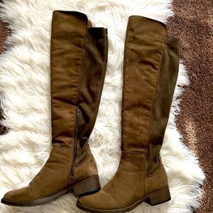 Over the knee military green boots.